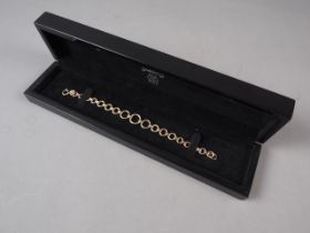A 9ct gold circular link bracelet, 12.7g, in presentation box