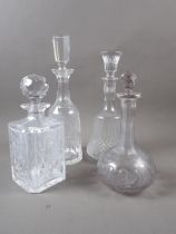 Four cut glass decanters and stoppers, tallest 13 1/2" high