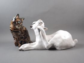 A Raku pottery white hare, 19" wide, and a Studio Six (Fulham) pottery cat, 11" high