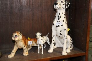 A Beswick seated Dalmatian 14" high, a Beswick standing dog, 8" long , and a model tiger, 11" long