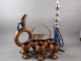 A Turkish ceramic moon-shaped ewer, six matching goblets, a blue glass hookah pipe and a brass jam