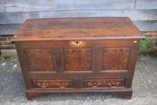 An early 18th century oak and fruitwood banded mule chest, fitted two drawers, on bracket feet,