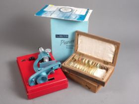 A Britex "Pioneer" microscope with "Polaroid" attachment, instruction book and two boxes of
