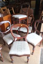A set of six late 19th century mahogany loop back dining chairs with drop-in seats, on turned