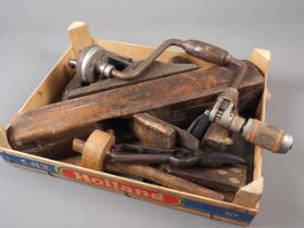 A carpenter's wooden plane and a number of other vintage tools