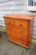 A late 19th century mahogany chest of two short and three long graduated drawers with mother-of-