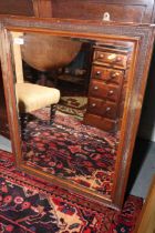 A late Victorian polished as mahogany rectangular bevelled plate wall mirror, plate 21" x 27", and a