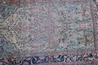 A Kirkman picture rug with trees, birds and figures, on a light ground, 86" x 54" approx (worn)