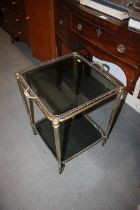 A brass framed two-tier trolley, 16" square x 26" high, and a copper warming pan with ebonised