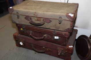 Two leather suitcases and a canvas suitcase