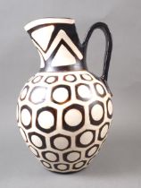 A South American? pottery jug with geometric designs, 11" high