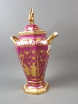 A Spode bone china two-handle octagonal vase and cover with gilt chinoiserie decoration on a pale