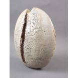An Alan Wallwork stoneware "split pebble" with grey glaze and ochre detailing, and AW mark, 9 1/2"