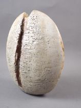 An Alan Wallwork stoneware "split pebble" with grey glaze and ochre detailing, and AW mark, 9 1/2"