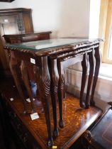 A nest of three glass top occasional tables, a matching coffee table, a wine table and a footstool,