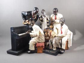 A composition African American jazz band, 18 1/2" high, a model of Louis Armstrong and an Elvis