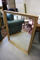 A rectangular gilt framed wall mirror, plate 35" x 27"