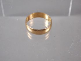 A 22ct gold wedding band, size T, 5.1g