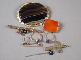 Two 9ct gold and amethyst rings, a yellow metal crucifix pendant, two 9ct gold bar brooches, two