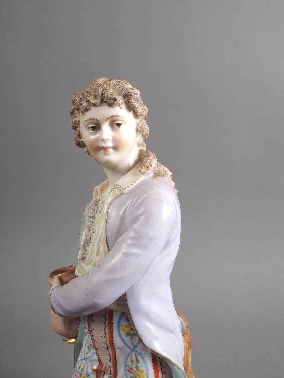 A German porcelain figure/spill vase, formed as a young man holding a jug, 11" high - Image 3 of 3