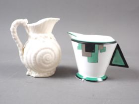 A Shelley bone china "Vogue Green Blocks", milk jug, 2 7/8" high, and a Belleek "Shell" milk jug, 4"