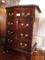 A mahogany serpentine front bedside chest of four drawers, 16" wide x 14" deep x 24" high