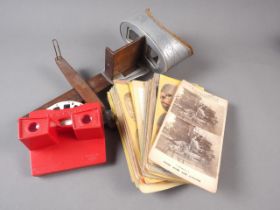 A Sun Sculptures stereoscopic viewer and a collection of stereo cards and "Stereobox" Viewmaster