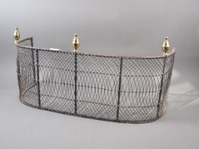 A 19th century brass mounted steel and wirework fender, 27" wide
