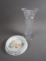 A cut glass flared vase, on circular base, 14" high, and a Lucie Mabel Attwell infant feeding dish
