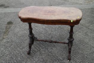 A 19th century burr walnut serpentine fold-over top card table, on twist turned and stretchered