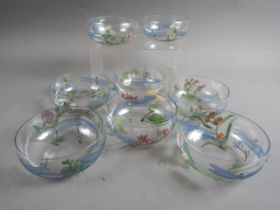 A set of eight Glasgow School hand-painted glass finger bowls, by Helen Walton, decorated