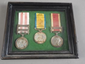 A set of three reproduced Victorian Indian campaign medals, including Lucknow bar