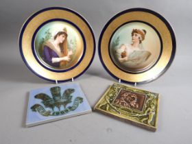 A pair of 19th century Continental cabinet plates with musical figure decoration and gilt borders,