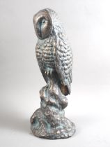 A patinated brass owl, 15" high