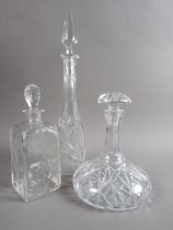 A ship's cut glass decanter, a spirit decanter and one other decanter and stopper