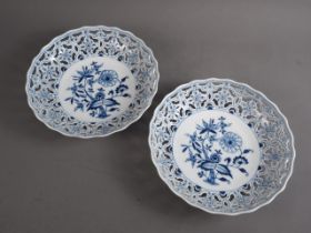 A pair of Meissen porcelain blue and white reticulated dishes with floral decoration, 10 1/2" dia (