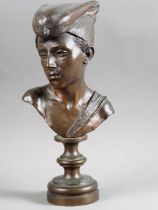 A 19th century Italian bronze portrait bust of a young man, on circular base, 12" high