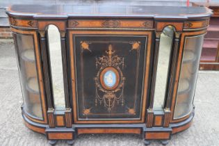 A mid Victorian burr walnut and inlaid ebonised break bowfront credenza enclosed central door, inset
