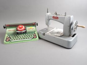 An Essex Miniature Sewing Machine and a Mettoy tin-plated "Supertype" toy typewriter