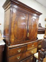 An oak linen press with box and ebony strung cornice, enclosed two doors (missing internal