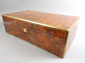 A 19th century burr walnut and brass mounted writing box with fitted interior and three "secret"