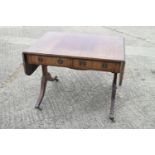 A 19th century mahogany and line inlaid sofa table, fitted two drawers with brass ring handles, on