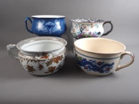 A Spode "Italian" chamber pot, a vine decorated chamber pot, a dragon decorated chamber pot and