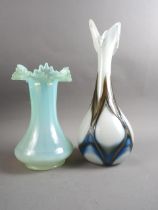 A vaseline glass vase with waved line, 10" high, and a studio glass vase with trailed decoration,