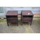 A pair of modern ebonised two-tier lamp tables, fitted one drawer, on square supports, 17 1/2"