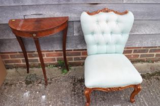 A polished as walnut spoon back bedroom chair, upholstered in mint green fabric, and a modern