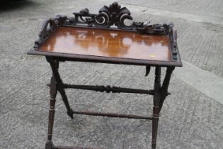 A butler's 19th century oak tray, on folding stand, 34" wide x 20" deep x 36" high