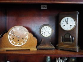An Edwardian oak cased balloon mantel clock with French cylinder movement, 10" high, and two other