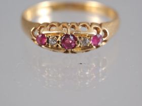 An Edwardian yellow metal, diamond and ruby set five stone ring, size Q, 2.3g gross, and a