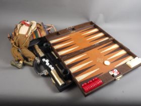 Two backgammon sets, in leather travel cases and a clown
